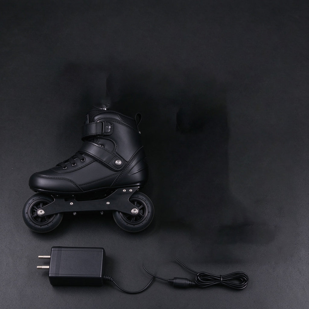 Pair of black electric skates with a charger